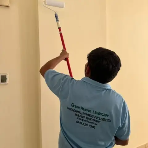 Painter cutting in on a fresh wall — Painting project photo, Dubai