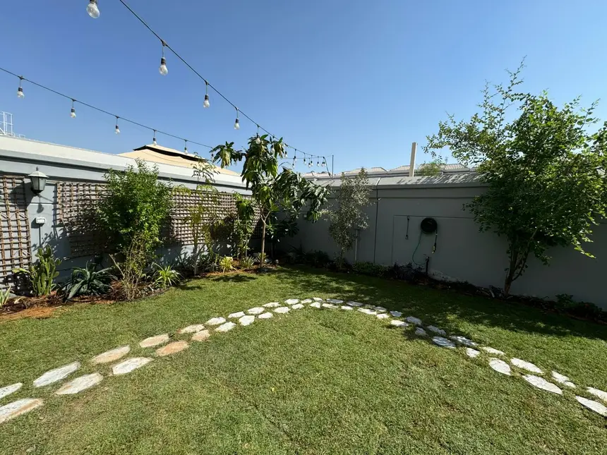 Garden with string lights, prepped for evening cooking — BBQ and Outdoor Kitchen project photo, Dubai