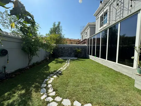Stone path along a white side yard — Green Heaven Landscape project photo, Dubai