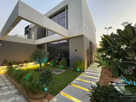 Villa garden lit at dusk — Green Heaven Landscape project photo, Dubai